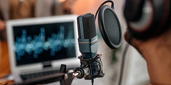 Person recording a podcast